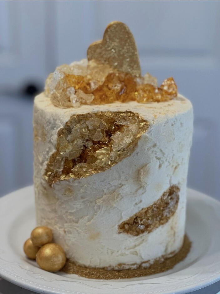 Gold Geode Cake White and gold buttercream cake with sparkling edible geode and gold details.
